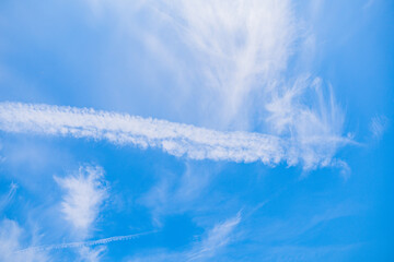 Contrails in the beautiful sky of sahlenburg, cuxhaven at a warm summer day with less clouds