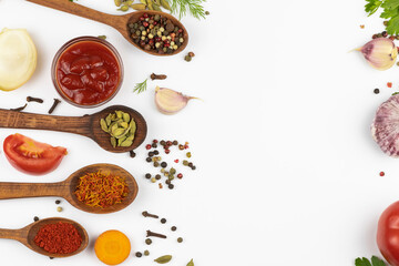  Fresh vegetables and spices, spices in wooden spoons, isolated on white background with space for text.