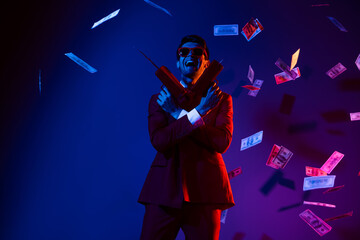 Photo of cool sweet young guy dressed formal suit glasses smiling dancing shooting money gun...
