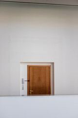 empty white room with wooden door