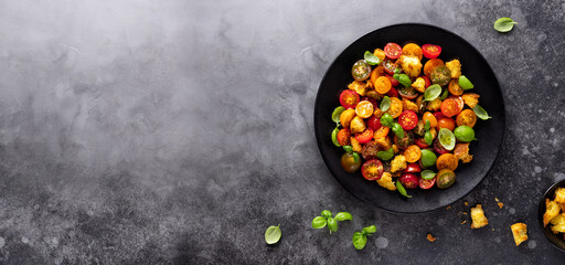 Cherry Tomatoes salad and bread. Traditional italian salad Panzanella. Healthy Mediterranean cuisine.Top view