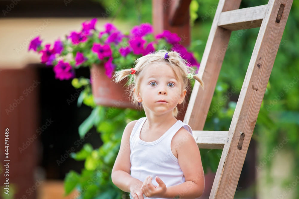 Canvas Prints Cute portrait of a sweet blond toddler child in garden