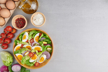 Diet menu. Healthy salad of fresh vegetables - tomatoes, egg, Onion. high angle view of a...