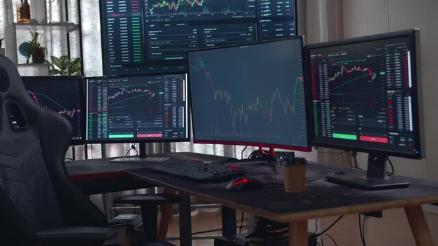 Stock Market Trader Multiple Computer Monitors With Financial Charts
