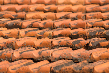 Background from red roof tiles on house. Old roof.