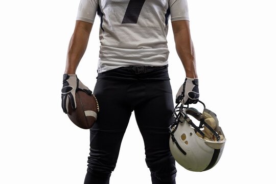 Cropped image of male American football player, athlete posing isolated on white studio background. Concept of professional sport, championship, competition.