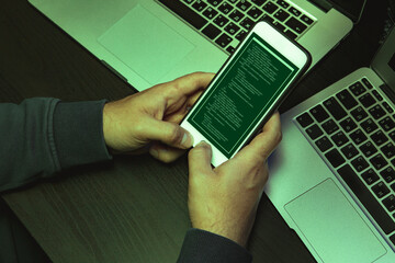 Close up of programmer of hacker hands typing a code