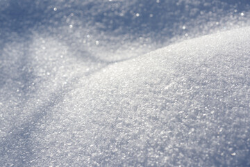 Pure white snow texture. Sparkling hills of snowflakes.