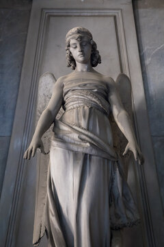 Statue of angel on an old tomb located in Genoa cemetery - Italy
