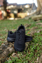 Black sneakers on grass
