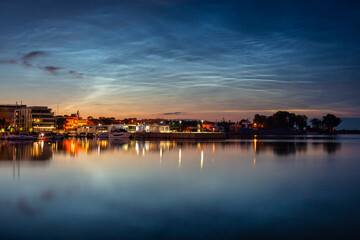Night scenery in Gdynia with noctilucent clouds over the harbor. Poland