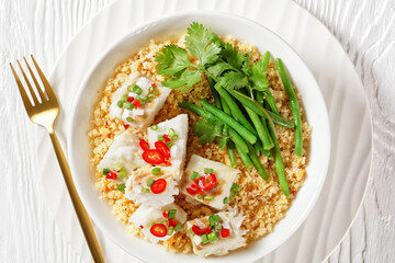 cod with bulgur, steamed green beans, top view