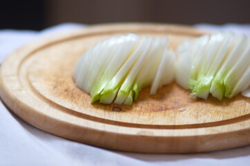 sliced onion on a wooden chopping board