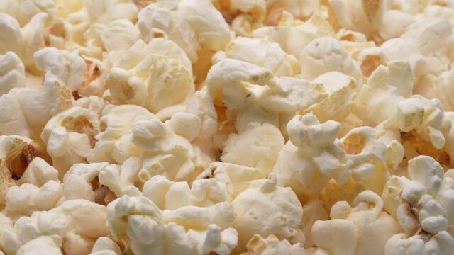 Closeup of a popcorn heap rotating.