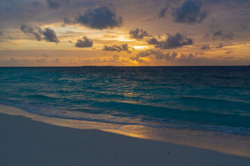 breathtaking view of the gorgeous sky at sunset from the pestled beach of the Maldives island