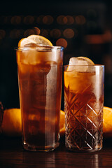 Cuba Libre, long island or iced tea cocktail with lemon