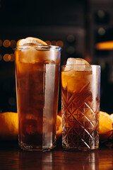 Cuba Libre, long island or iced tea cocktail with lemon