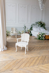 Fototapeta na wymiar chair by the window. interior in the bedroom. classic armchair