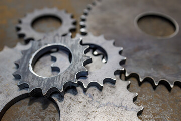 spare parts made of steel on a metal table, in a repair shop