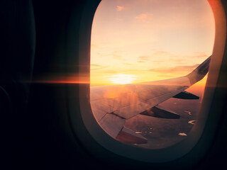 In plane flight view from window with stunning sunset background and copy paste vertical background