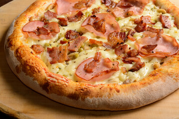 Sirloin and bacon pizza on a wooden board. Brazilian pizza.