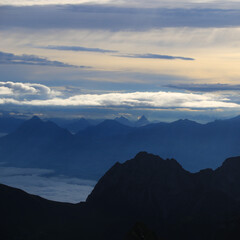 Fototapeta na wymiar Dramatic morning sky over Mount Stanserhorn and other mountains of the Swiss Alps.