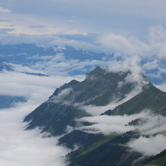 Augstmatthorn seen from Brienzer Rothorn. Mountain near Interlaken. Fog creeping around.