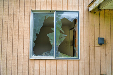 Broken glasses on the window of an old abandoned house in Washington State