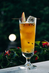 Refreshing summer cocktail with peach and passion fruit