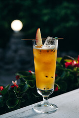 Refreshing summer cocktail with peach and passion fruit