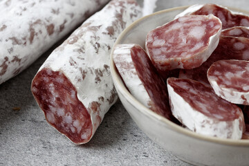 Sliced fuet typical Catalan sausage. Thin dried sausage.