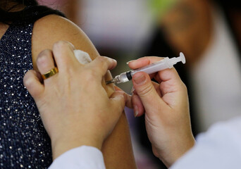 A nurse gives a shot of the Janssen, Johnson and Johnson, COVID-19 vaccine during a vaccination...