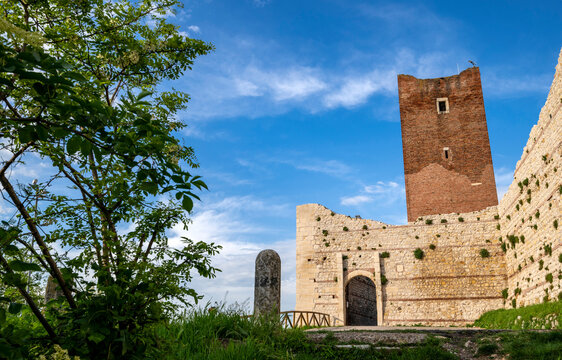 Stone entrance with the tower of Romeo and Juliet s castle in the