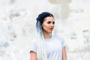 Urban young woman with african braids. Fashion of youth