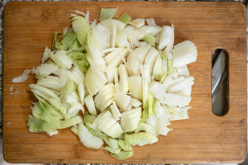 Fresh onions on cutting board