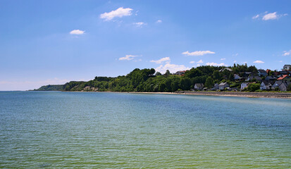 View from the Baltic Sea on the coast and the beach in Mechelinki in Pomerania. 