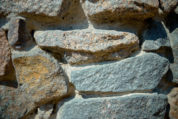 Wall of large stones as texture or background