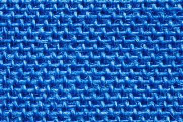 Cotton textile macro detail. Close-up of textured blue tissue cloth weave