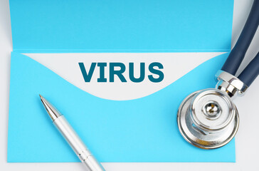 There is a stethoscope on the table, an envelope with paper on which it is written - VIRUS