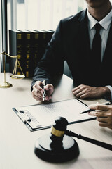 Lawyer hand holding pen and providing legal consult business dispute to the man.