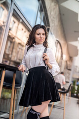 alone fashion sexy woman posing at city center