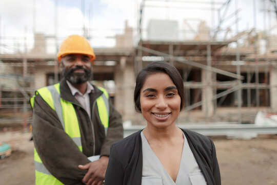 Portrait confident engineer and forewoman at construction site
