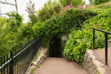 Entrance to walkway from Babbacombe Downs leading downhill to Babbacombe Beach in Torquay in England.