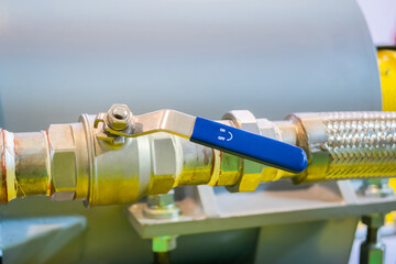 Manual stainless ball valves in pipes for water supply at factory, plant- close up. Industrial,...