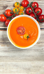 Tomato soup served with fresh cherry tomatoes