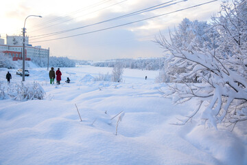 Fototapeta na wymiar MURMANSK, RUSSIA - FEBRUARY 10, 2021: Semonovskoye lake covered by snow in winter