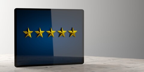 Five golden stars on tablet comoputer display background on wooden table, product or service quality rating symbol concept