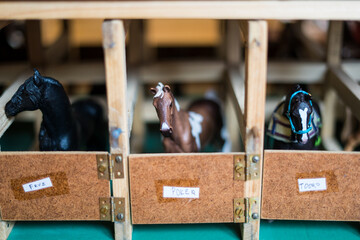 Toy horses in a wooden box