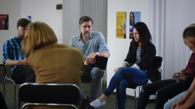 Group leader helping people with mental disorders