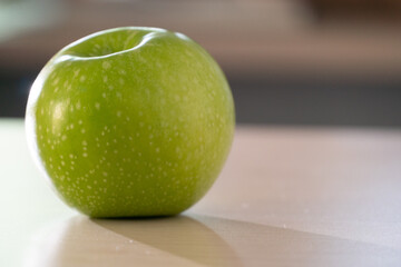 green apple on a table